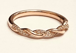photo of 14 karat yellow gold twist ring with 1/10 carat of accent diamonds item 001-425-00144
