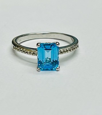 photo number one of Sterling silver blue topaz ring with white topaz accents item 001-220-00700