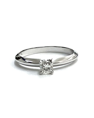 photo number one of 10 karat white gold solitaire with 14 karat white gold prongs. 0.20 carat round natural diamond item 001-421-00028