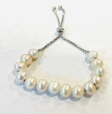photo number one of Sterling silver freshwater pearl bracelet with bolo clasp item 001-620-00342