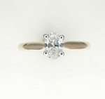 photo of 14 karat two tone solitaire ring with oval 0.42 carat natural diamond with I1 clarity and g/h color item 001-421-00029